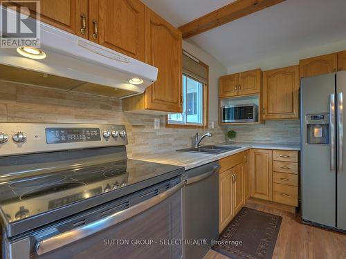 8278 Burwell Road, Lambton Shores (Port Franks), ON - Indoor Photo Showing Kitchen With Double Sink