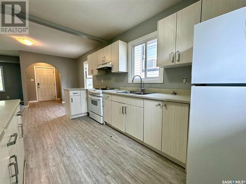 704 P Avenue N, Saskatoon, SK - Indoor Photo Showing Kitchen With Double Sink