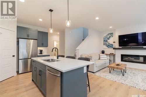 417 Germain Manor, Saskatoon, SK - Indoor Photo Showing Kitchen With Fireplace With Double Sink With Upgraded Kitchen