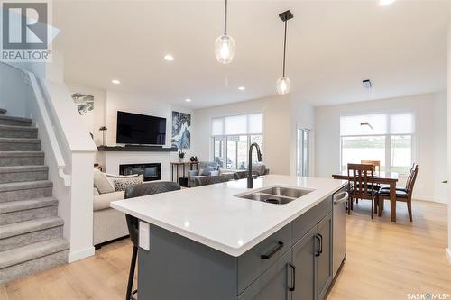 417 Germain Manor, Saskatoon, SK - Indoor Photo Showing Kitchen With Fireplace With Double Sink