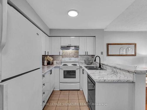 165-99 Bristol Rd, Mississauga, ON - Indoor Photo Showing Kitchen With Double Sink