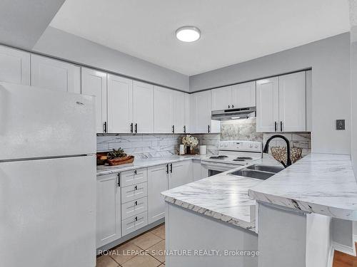 165-99 Bristol Rd, Mississauga, ON - Indoor Photo Showing Kitchen With Double Sink