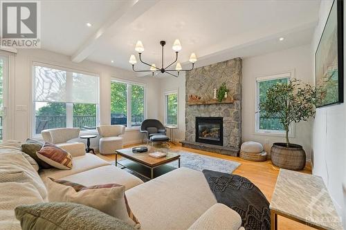 1463 Big Rideau North Shore Road, Perth, ON - Indoor Photo Showing Living Room With Fireplace