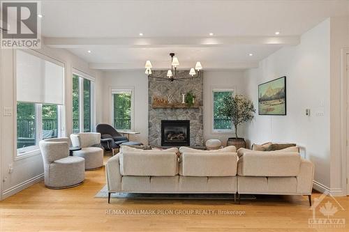 1463 Big Rideau North Shore Road, Tay Valley, ON - Indoor Photo Showing Living Room With Fireplace