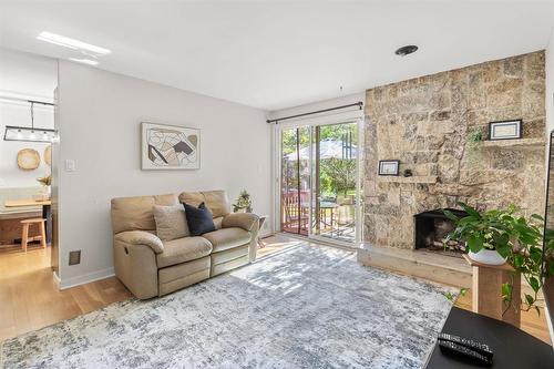 17 Aquin Street, Elie, MB - Indoor Photo Showing Living Room With Fireplace