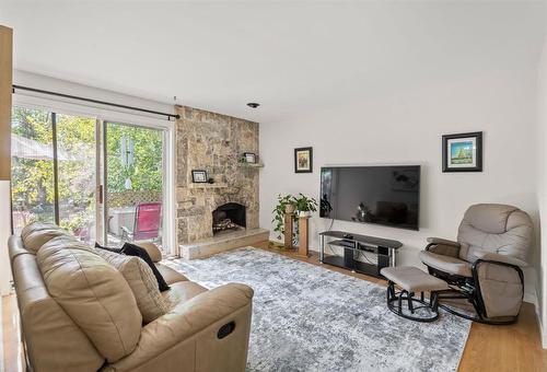 17 Aquin Street, Elie, MB - Indoor Photo Showing Living Room With Fireplace