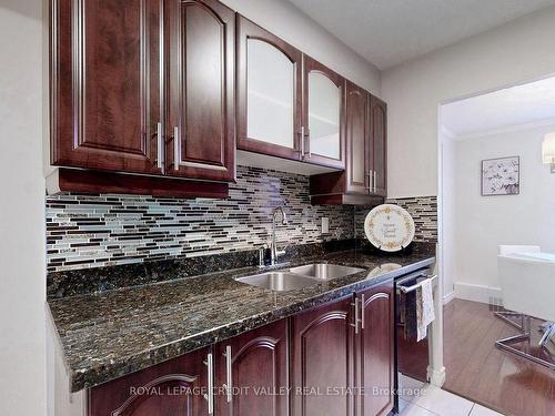 703-90 Ling Rd, Toronto, ON - Indoor Photo Showing Kitchen With Double Sink