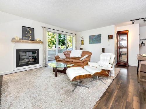 205-1055 Hillside Ave, Victoria, BC - Indoor Photo Showing Living Room With Fireplace