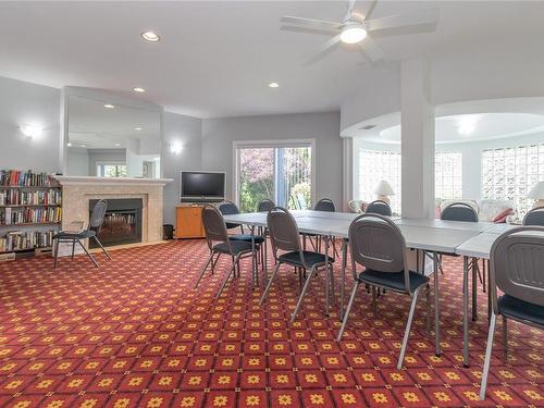 201-3969 Shelbourne St, Saanich, BC - Indoor Photo Showing Dining Room With Fireplace