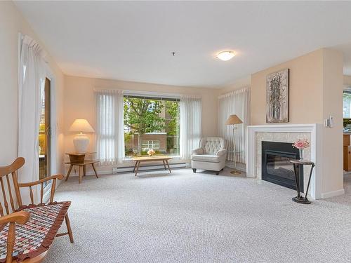 201-3969 Shelbourne St, Saanich, BC - Indoor Photo Showing Living Room With Fireplace