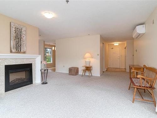 201-3969 Shelbourne St, Saanich, BC - Indoor Photo Showing Living Room With Fireplace