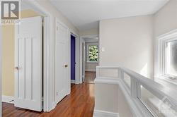 Windows and partial glass wall brighten hallway - 