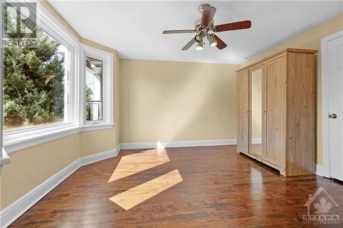 Bright primary bedroom with bay window and beautiful hardwood flooring. Wardrobe can be included if Buyer would like it. - 11 Gilchrist Avenue, Ottawa, ON - Indoor Photo Showing Other Room