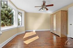 Bright primary bedroom with bay window and beautiful hardwood flooring. Wardrobe can be included if Buyer would like it. - 