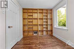 Practical shelving in 3rd bedroom is ideal for a home office/ student/ reading room. - 