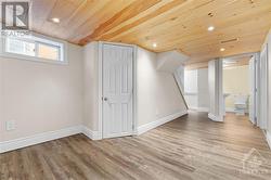 Recently renovated basement provides additional recreation or work space. Lovely wood ceiling with pot lights. - 