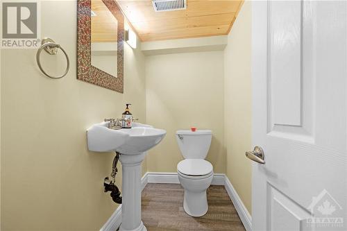 Convenient basement powder room - 11 Gilchrist Avenue, Ottawa, ON - Indoor Photo Showing Bathroom