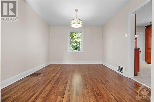 Spacious dining room with new modern light fixture - 11 Gilchrist Avenue, Ottawa, ON - Indoor Photo Showing Other Room