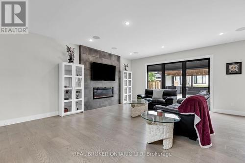 Integrated Sound System - 3495 Grand Oak Cross, London, ON - Indoor Photo Showing Living Room With Fireplace