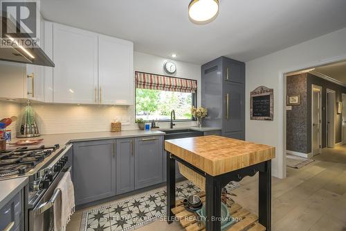 Custom tile \"inset runner\" in front of sink - 824 Clearview Avenue, London, ON - Indoor Photo Showing Kitchen