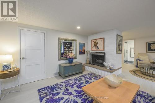 Wood burning fireplaces on both floors - 824 Clearview Avenue, London, ON - Indoor Photo Showing Living Room With Fireplace