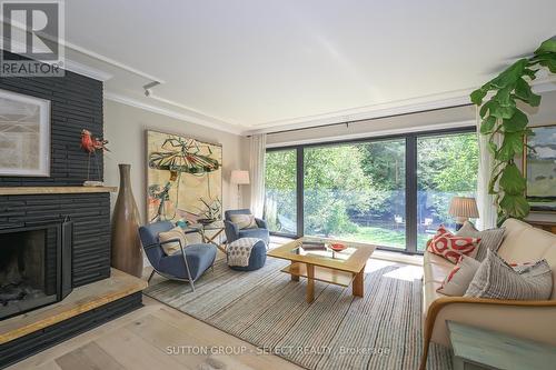 Floor-to-ceiling windows in living room - 824 Clearview Avenue, London, ON - Indoor Photo Showing Living Room With Fireplace