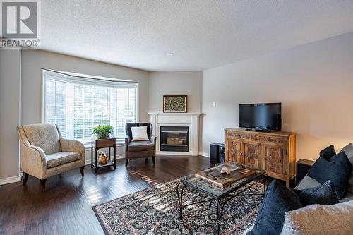 18 - 2880 Headon Forest Drive, Burlington, ON - Indoor Photo Showing Living Room With Fireplace