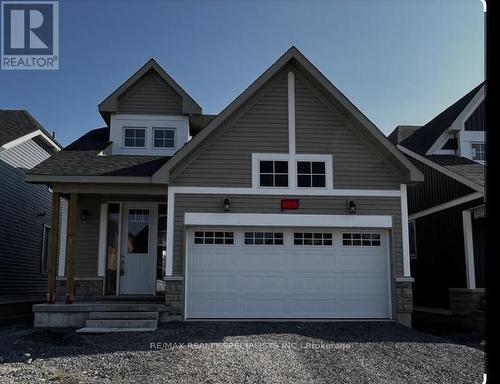 104 Oakmont Drive, Loyalist, ON - Outdoor With Facade