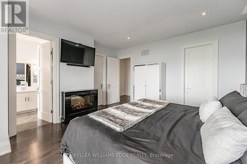 1083 Beach Boulevard, Hamilton, ON - Indoor Photo Showing Bedroom With Fireplace