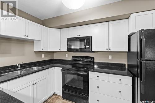 104 150 Pawlychenko Lane, Saskatoon, SK - Indoor Photo Showing Kitchen With Double Sink