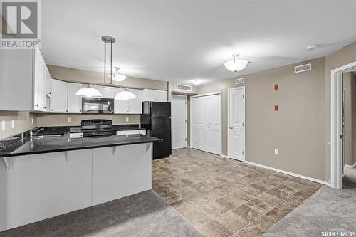 104 150 Pawlychenko Lane, Saskatoon, SK - Indoor Photo Showing Kitchen With Double Sink