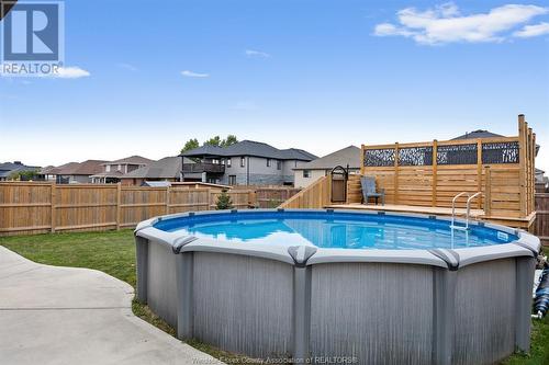 202 Spring Street, Belle River, ON - Outdoor With Above Ground Pool With Backyard