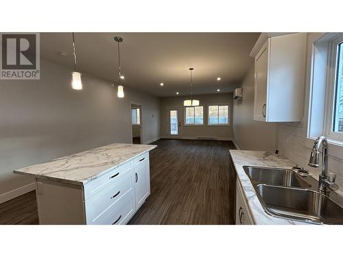 8 105 Forest Ridge Road, 100 Mile House, BC - Indoor Photo Showing Kitchen With Double Sink