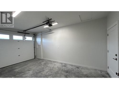 8 105 Forest Ridge Road, 100 Mile House, BC - Indoor Photo Showing Garage