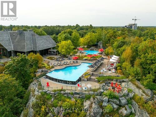 102 - 120 Carrick Trail, Gravenhurst, ON - Outdoor With In Ground Pool With View