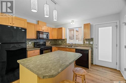 49 2751 Windsor Park Road, Regina, SK - Indoor Photo Showing Kitchen With Double Sink