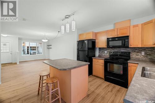 49 2751 Windsor Park Road, Regina, SK - Indoor Photo Showing Kitchen With Double Sink