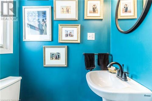 This 2 piece bathroom, is off the foyer - 1026 St Matthews Avenue, Burlington, ON - Indoor Photo Showing Bathroom