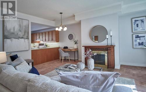 10 - 110 Mary Street W, Whitby (Downtown Whitby), ON - Indoor Photo Showing Living Room With Fireplace