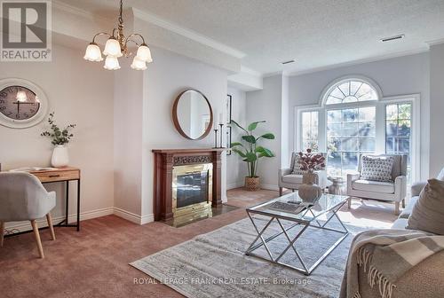 10 - 110 Mary Street W, Whitby (Downtown Whitby), ON - Indoor Photo Showing Living Room With Fireplace