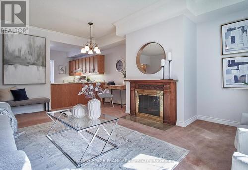 10 - 110 Mary Street W, Whitby (Downtown Whitby), ON - Indoor Photo Showing Living Room With Fireplace