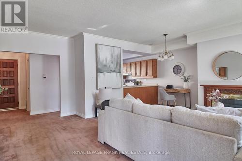 10 - 110 Mary Street W, Whitby (Downtown Whitby), ON - Indoor Photo Showing Living Room With Fireplace