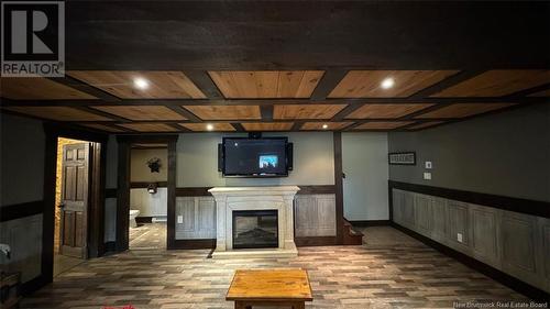 8 King Street, Saint-Léonard, NB - Indoor Photo Showing Basement With Fireplace