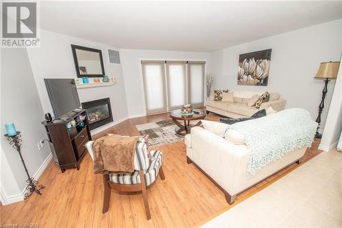 401 Birmingham Street E Unit# 305, Mount Forest, ON - Indoor Photo Showing Living Room With Fireplace