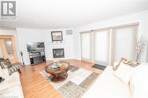 401 Birmingham Street E Unit# 305, Mount Forest, ON - Indoor Photo Showing Living Room With Fireplace