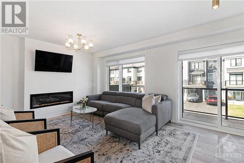 93 Kyanite Lane, Ottawa, ON - Indoor Photo Showing Living Room With Fireplace