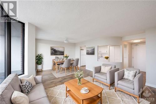 This photo has been virtually staged. - 99 Holland Avenue Unit#705, Ottawa, ON - Indoor Photo Showing Living Room