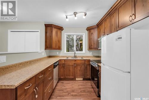 132B 110Th Street W, Saskatoon, SK - Indoor Photo Showing Kitchen With Double Sink