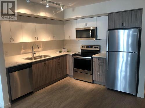 655 Academy Way Unit# 217, Kelowna, BC - Indoor Photo Showing Kitchen With Stainless Steel Kitchen With Double Sink