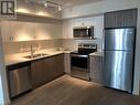 655 Academy Way Unit# 217, Kelowna, BC  - Indoor Photo Showing Kitchen With Stainless Steel Kitchen With Double Sink 